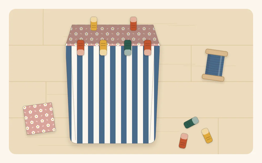 Illustration of a fabric basket with the floral lining pushed down inside the striped outer, top edges level before topstitching