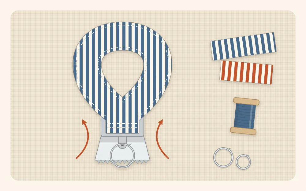 Flat illustration of the folded loop end of a fabric strap sitting inside an open metal key fob clamp