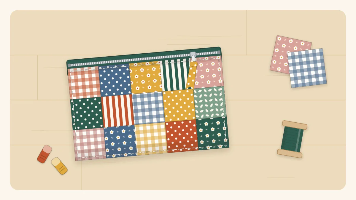 A small patchwork zipper pouch with a contrasting zipper pull