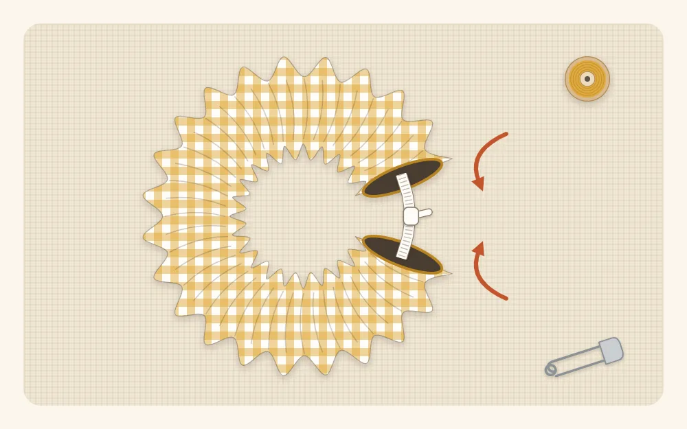 Illustration of a fabric tube gathered into ruffles on a loop of elastic with the two open ends not yet joined